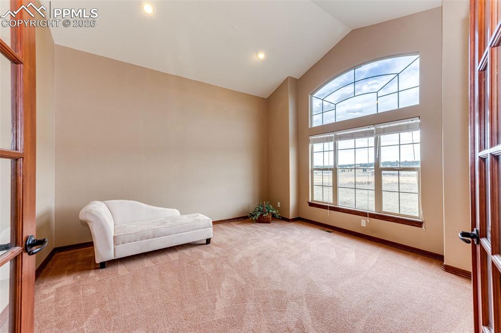 Image 6 of 49: Front office desk with French Doors