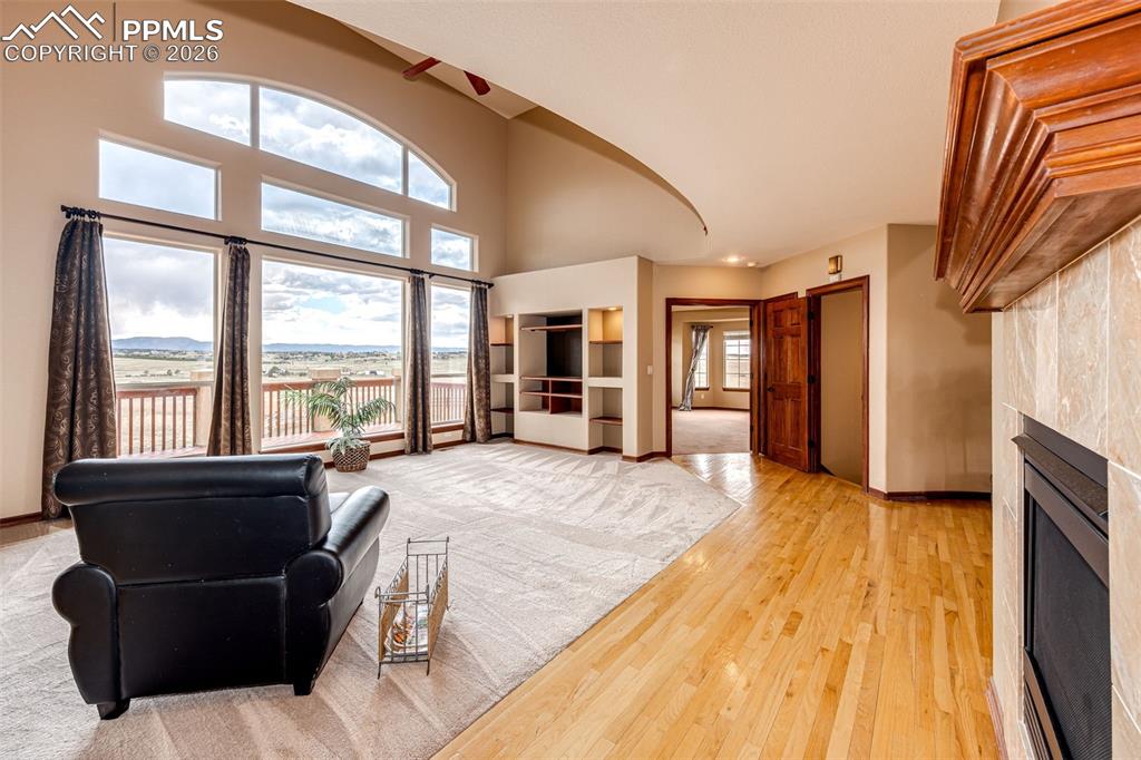 Image 9 of 49: Has 2 way gas fireplace to Dining room