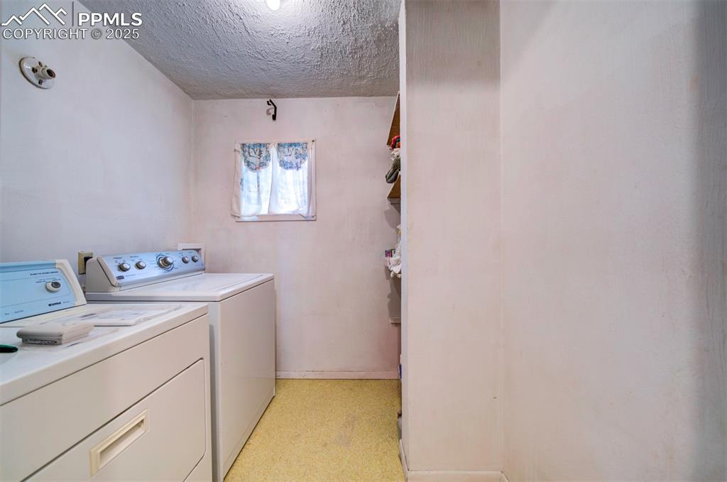 Image 11 of 22: Large laundry room on main level.
