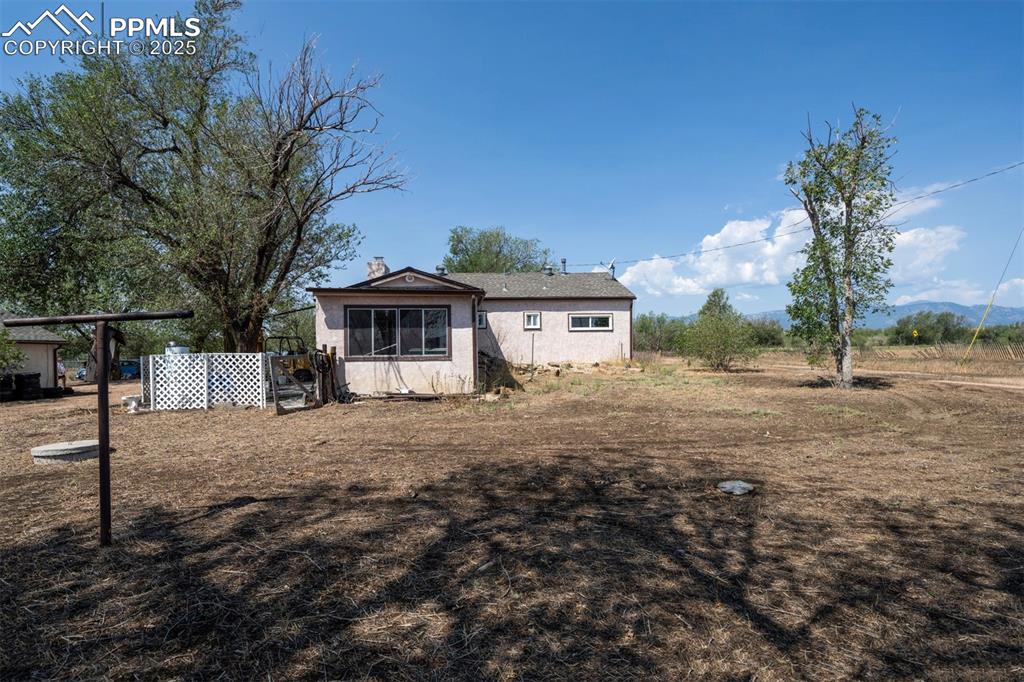 Image 4 of 22: View of the back of the house.