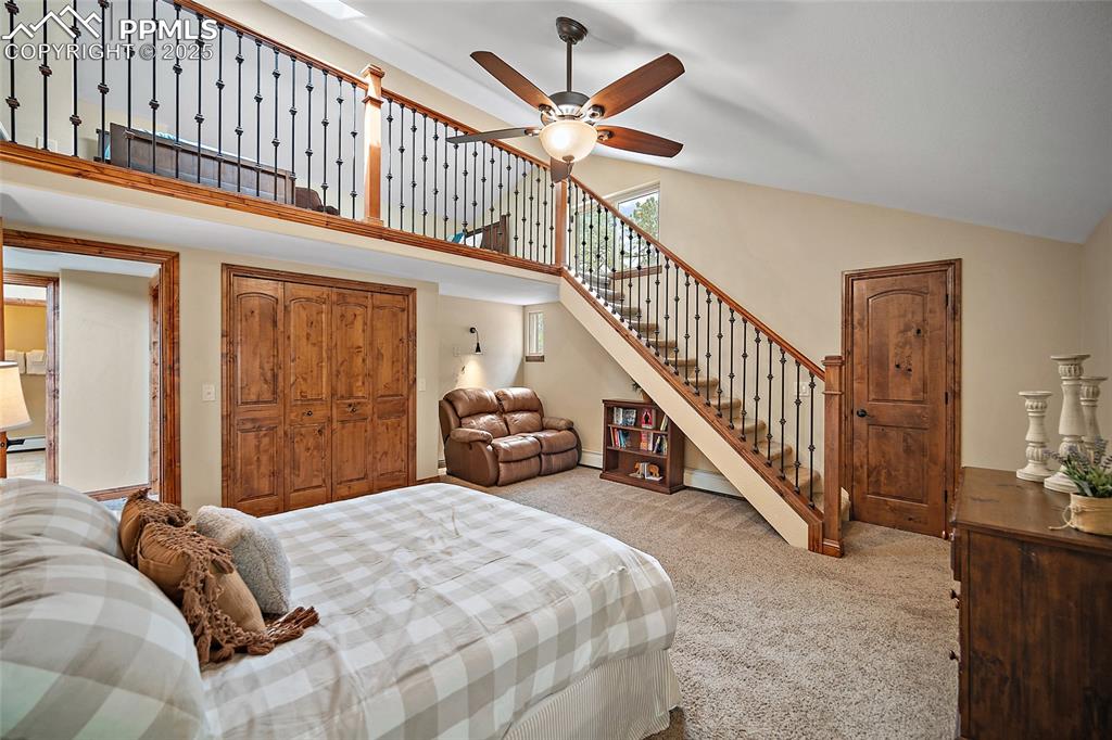 Image 28 of 47: Bedroom featuring carpet floors, high vaulted ceiling, a closet, a ceiling