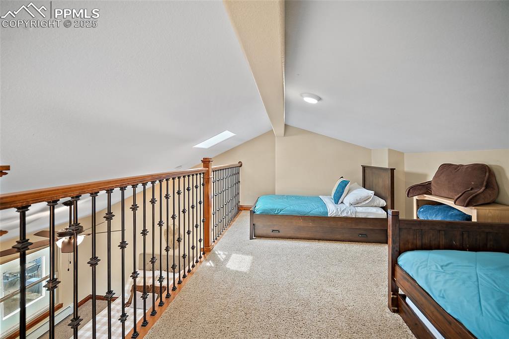 Image 29 of 47: Bedroom featuring carpet floors and a baseboard radiator