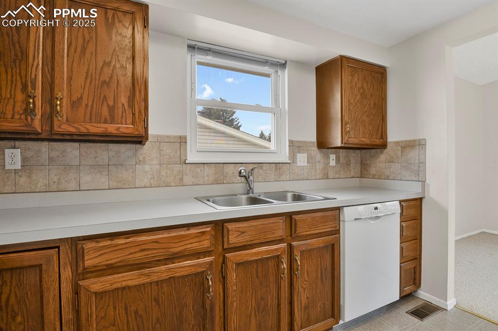 Image 18 of 45: Kitchen with brown