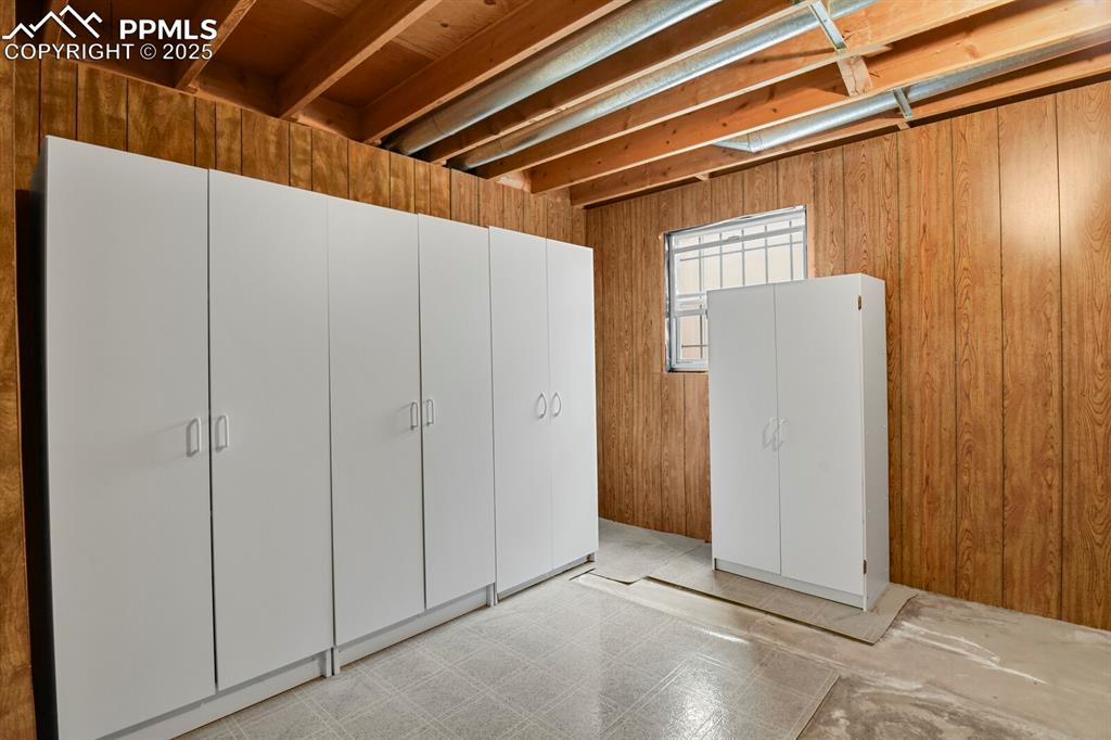 Image 36 of 45: Storage cabinets included