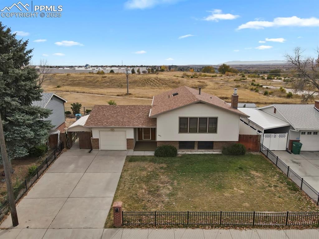 Image 41 of 45: Ranch-style home featuring brick siding, concrete driveway, an attached gar