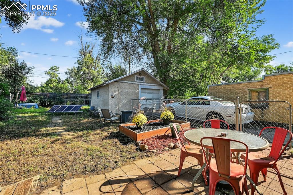 Image 25 of 28: Big, fenced in backyard and OVERSIZED detached garage. 