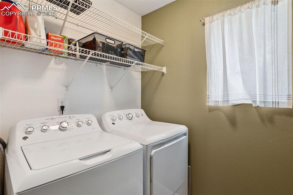 Image 16 of 40: Laundry room with washer and dryer
