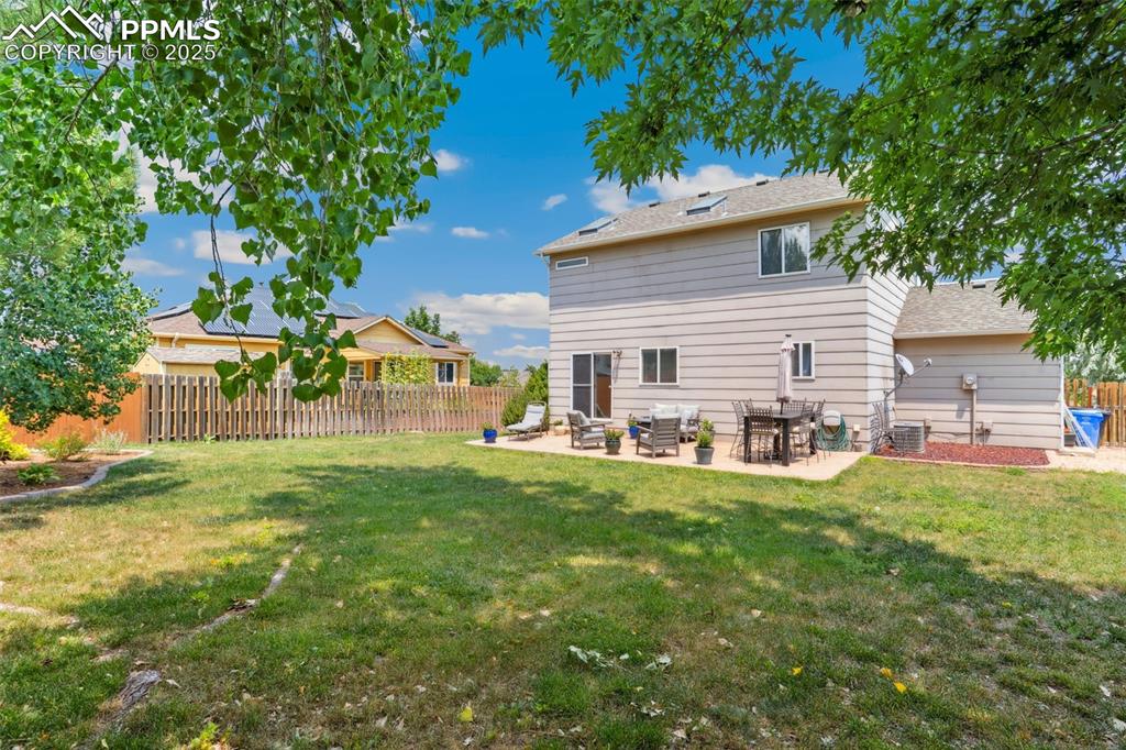 Image 34 of 40: Rear view of property with a patio and a shingled roof