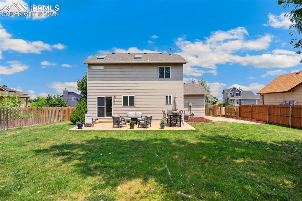 Image 36 of 40: Rear view of property featuring a patio area and a fenced backyard