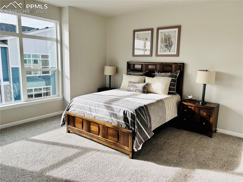 Image 8 of 11: Carpeted bedroom featuring baseboards