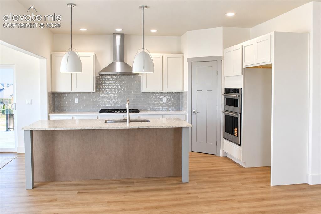 Image 14 of 44: Kitchen featuring a central island with countertop, stainless steel applian
