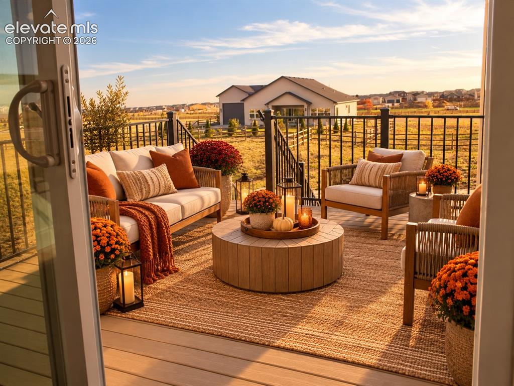 Image 17 of 44: Expansive outdoor deck with composite decking and black metal railing