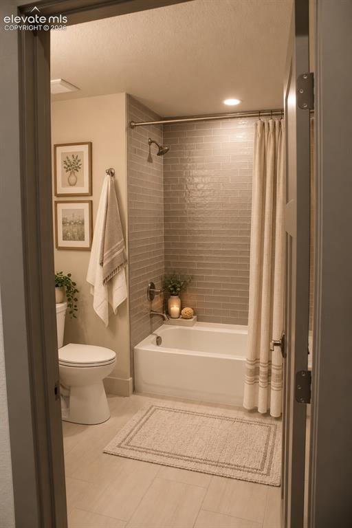 Image 43 of 44: Subway tile shower surround with a fixed showerhead and tub, complemented b