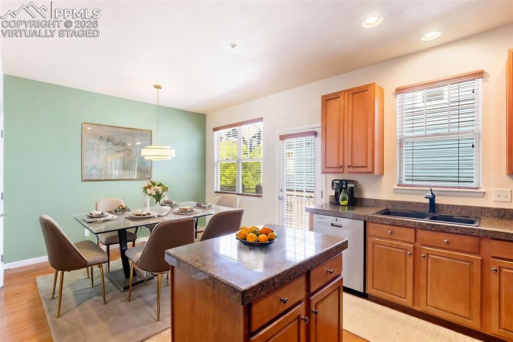 Image 12 of 34: Virtually Staged kitchen with dining area