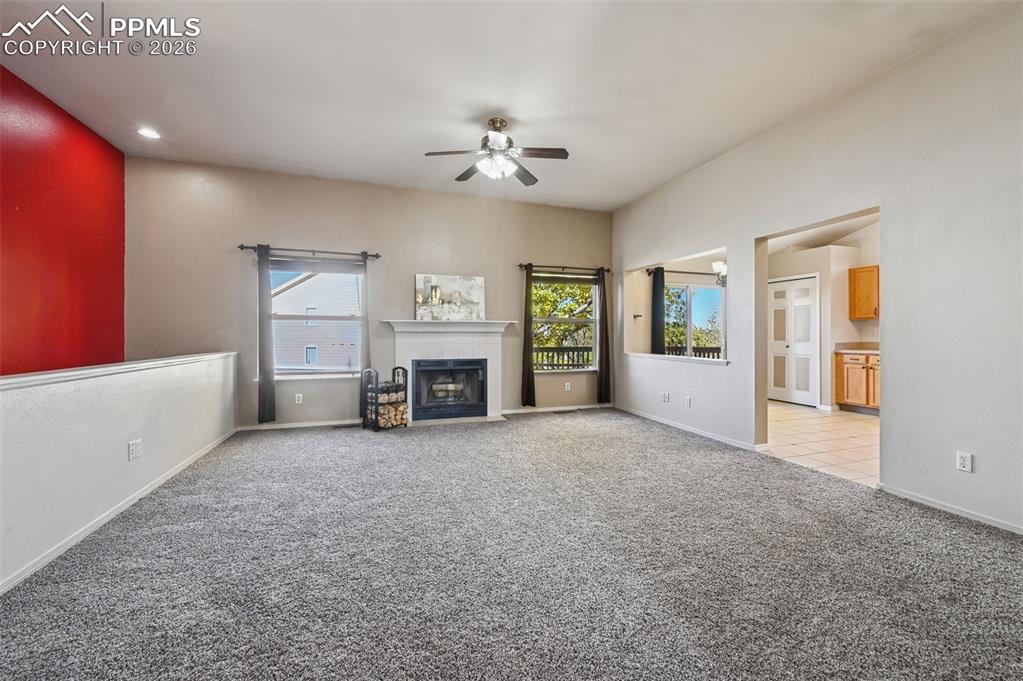 Image 3 of 35: Vaulted ceilings, wood burning fireplace and new carpet