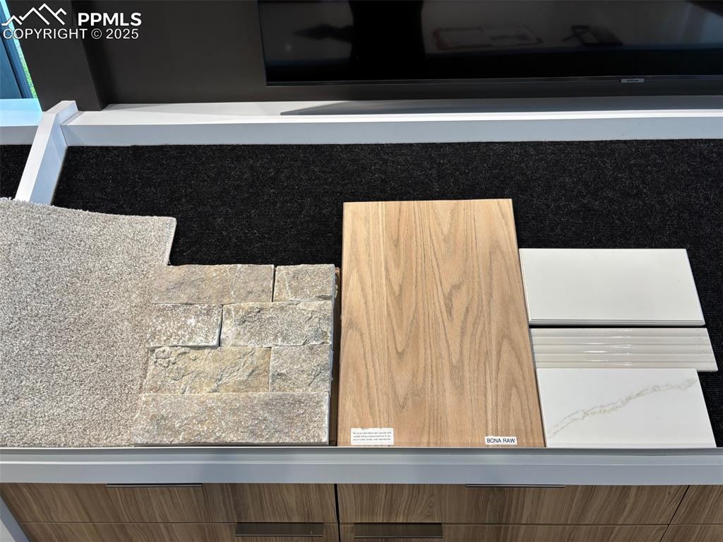 Image 4 of 9: Carpet, Fireplace Stone, Hardwood, and Kitchen selections