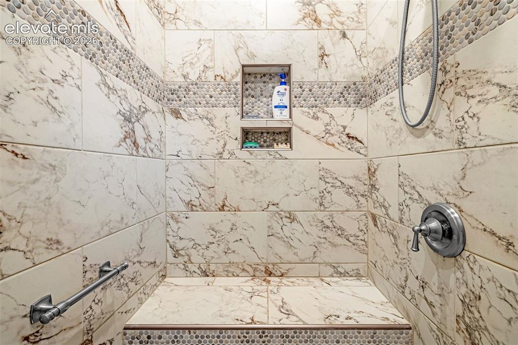 Image 18 of 38: Luxury walk in shower.