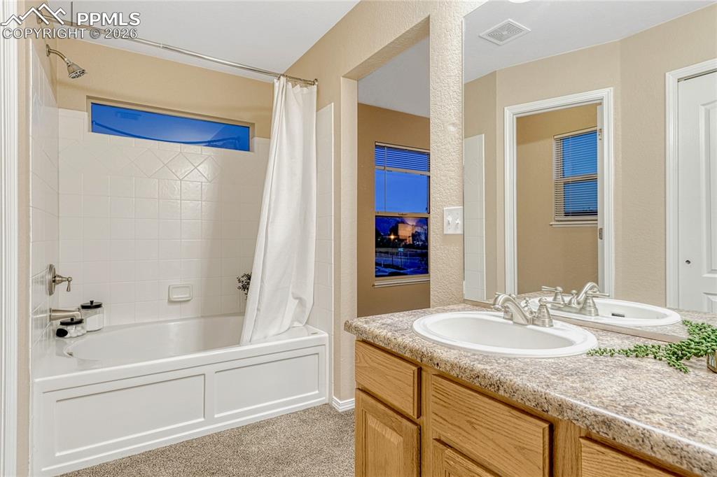 Image 33 of 50: Dual sinks, separate water closet