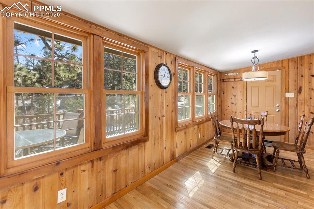 Image 14 of 46: Living Room with original stone fireplace