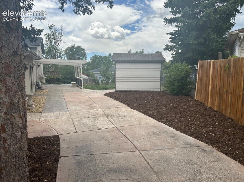 Image 28 of 29: 10 x 12 Shed with RV parking