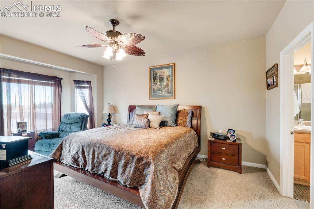 Image 28 of 40: Master bedroom with bay window