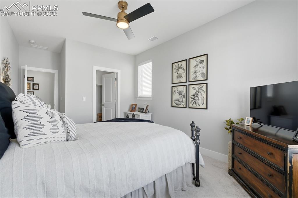 Image 30 of 50: Bedroom three with walk-in closet 