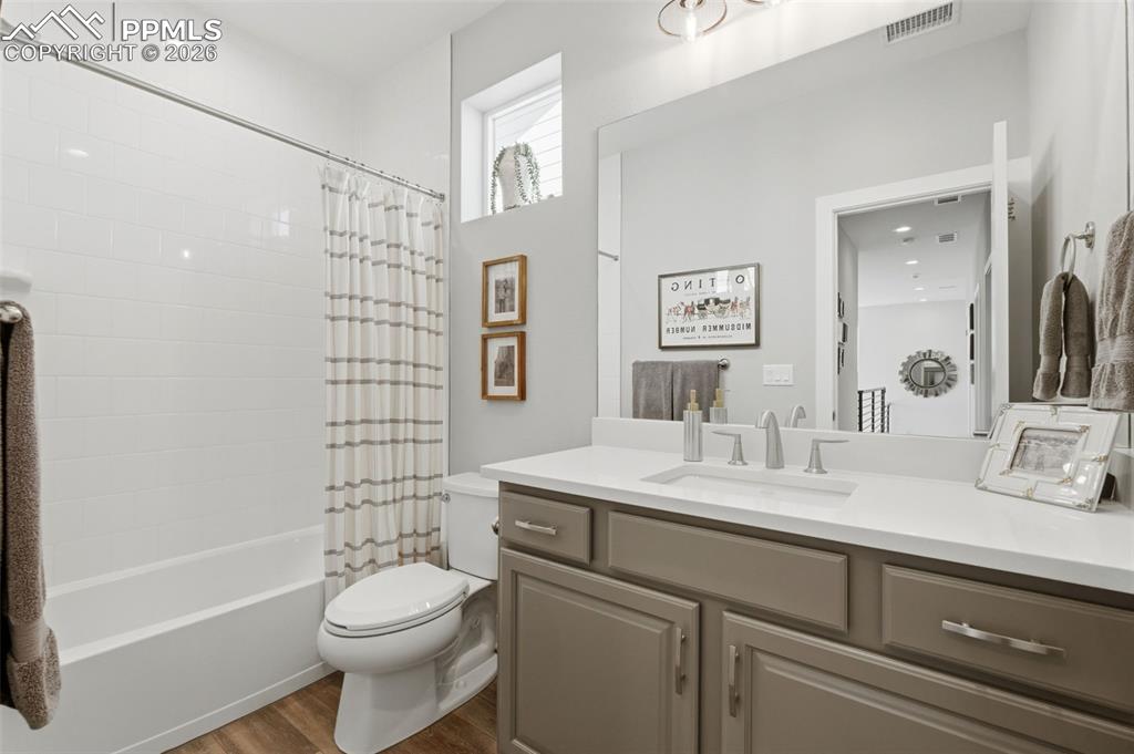 Image 32 of 50: Second full bath upstairs, raised vanities, floor to ceiling tile