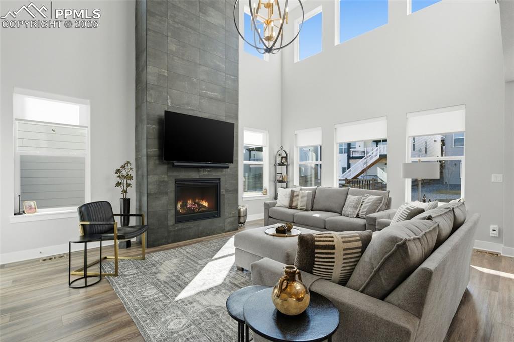 Image 4 of 50: Great room showcasing Hinkley lighting and floor to ceiling tile