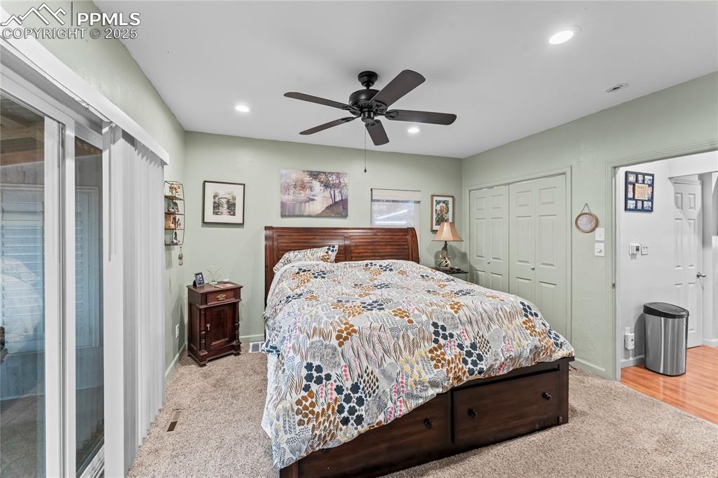 Image 15 of 27: Bedroom featuring a closet, ceiling fan, recessed lighting, access to outsi