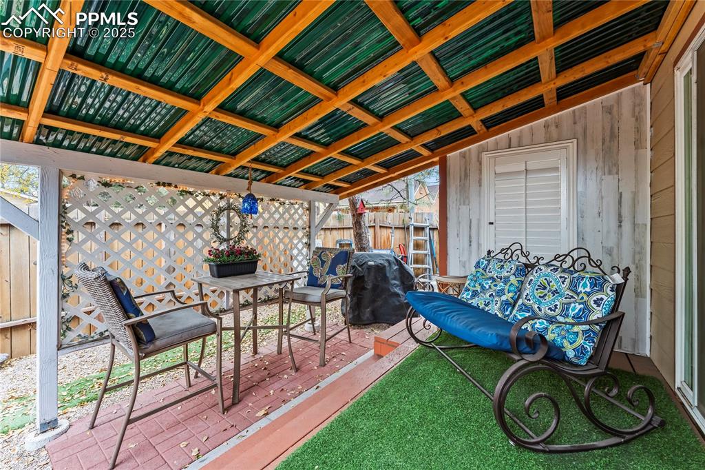 Image 20 of 27: View of patio featuring a deck and area for grilling