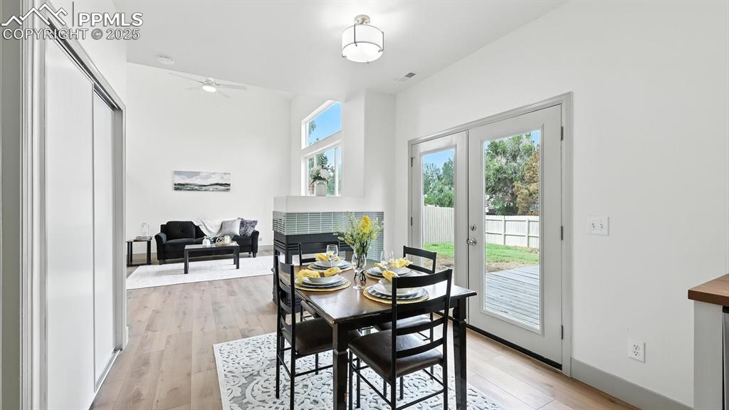 Image 12 of 50: The dining area offers a pantry closet for additional kitchen storage.