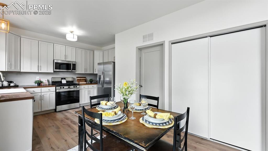 Image 15 of 50: Dining area and kitchen.