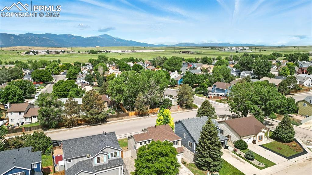 Image 3 of 50: Aerial view of the front of the house, established neighborhood with mature