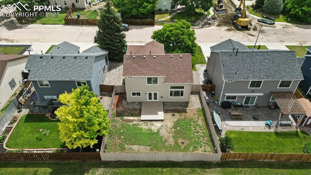 Image 48 of 50: Aerial rear view of home and backyard.