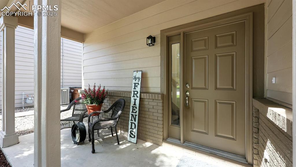 Image 5 of 50: The charming covered front porch sets a welcoming tone, perfect for morning