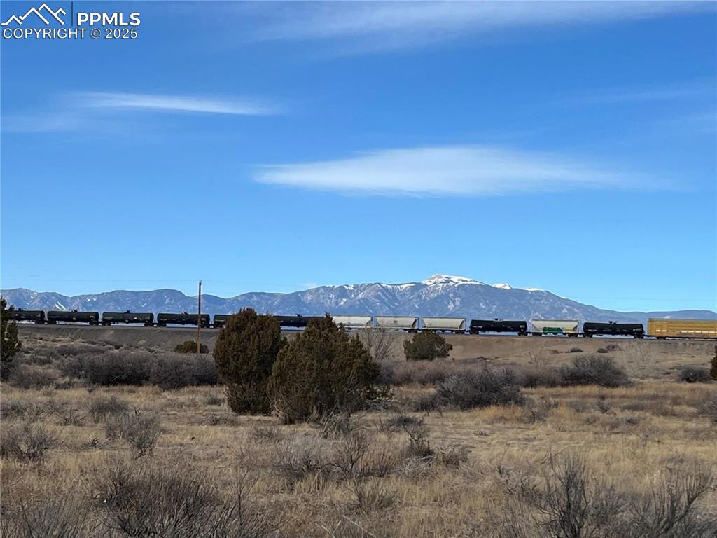 Caption: View of mountain background featuring rural landscape