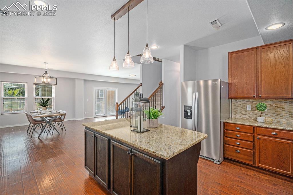 Image 18 of 44: Open to second dining and living area - perfect for entertaining!