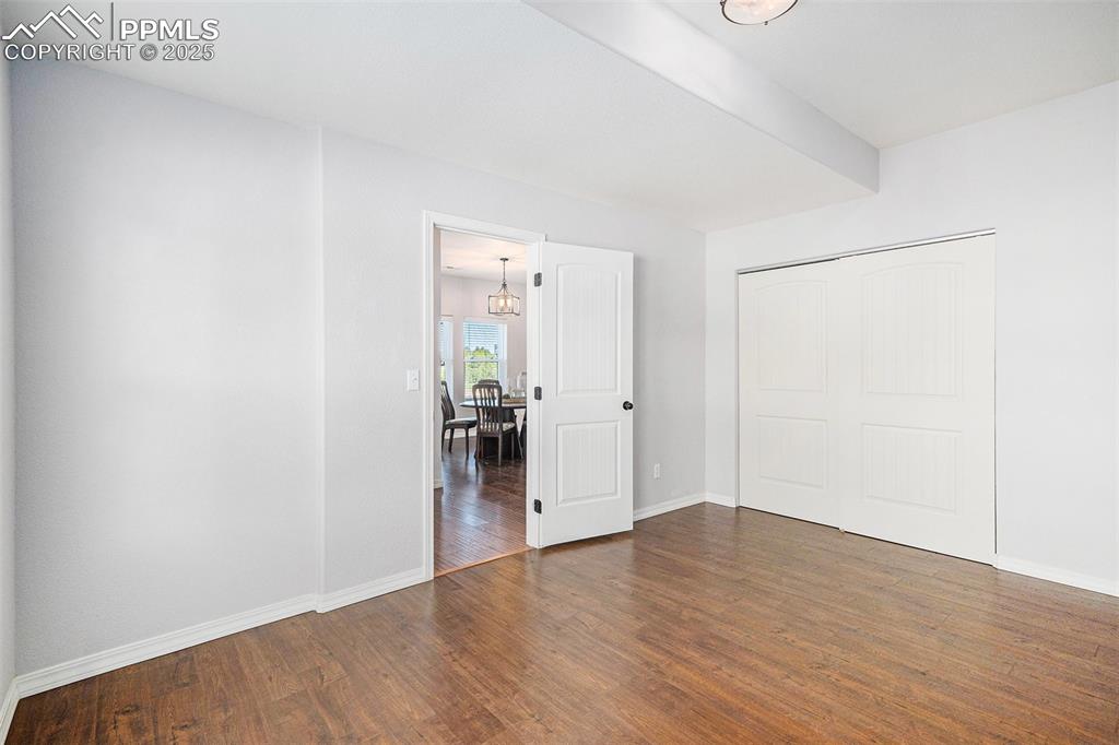 Image 7 of 44: Main level bedroom is perfect for guests!