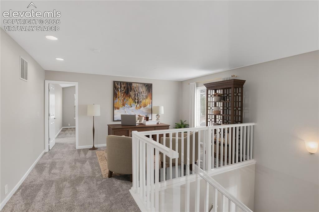 Image 19 of 41: Garage interior, with additional storage area on the right.