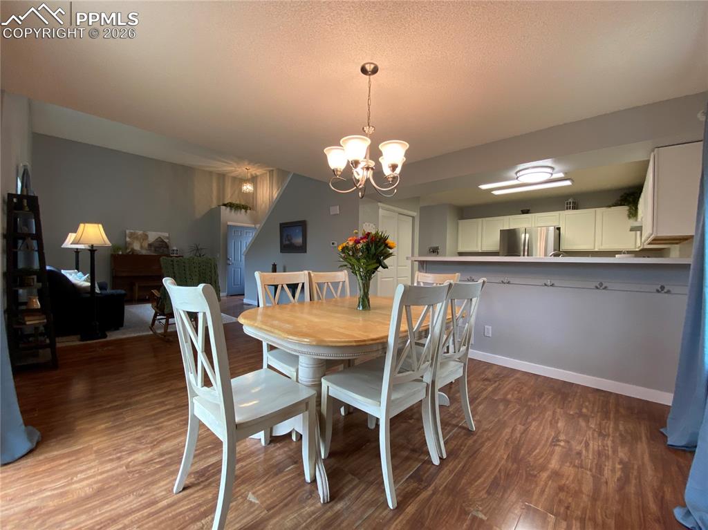 Image 15 of 34: The dining room has a bonus breakfast bar