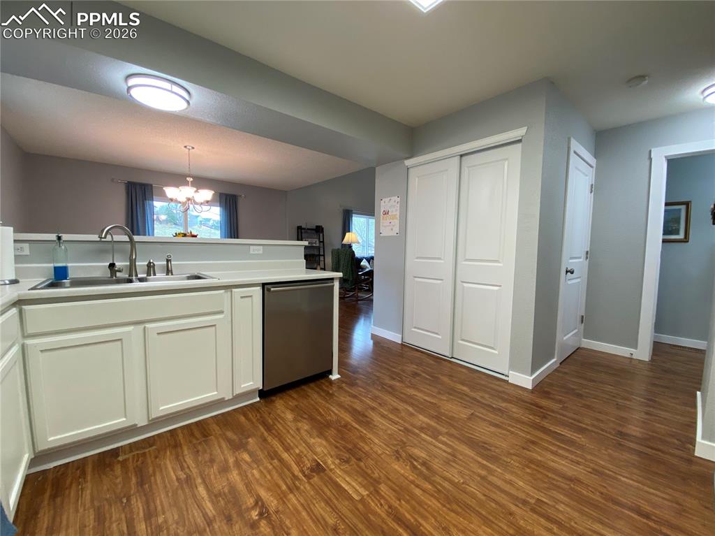 Image 17 of 34: The kitchen pantry features NEW sliding doors