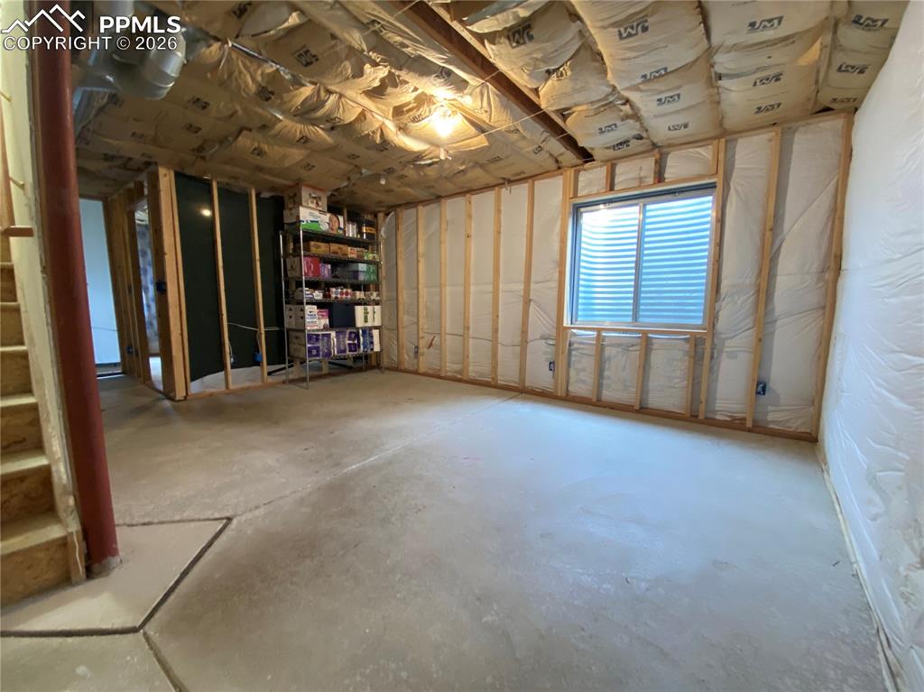 Image 24 of 34: Additional insulation and some framing already in the basement