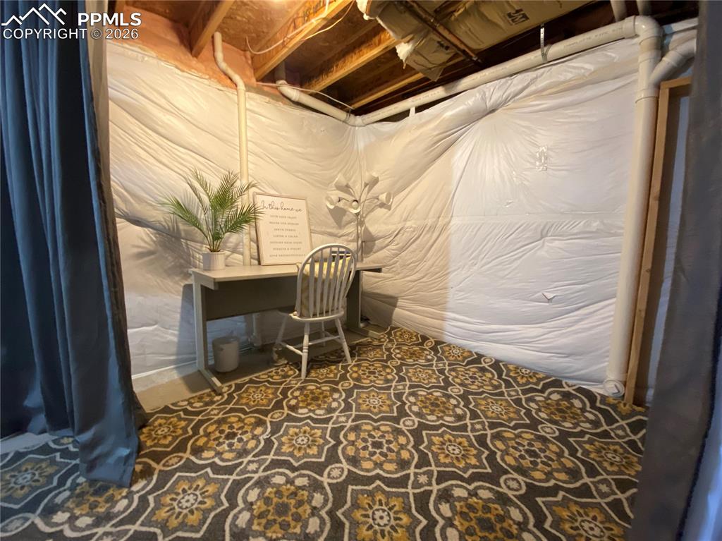 Image 27 of 34: Rough-in for another FULL bathroom (currently an office area)