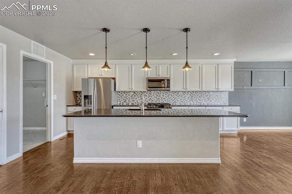 Image 15 of 45: Bring your passion for cooking to life in this exceptional kitchen, boastin