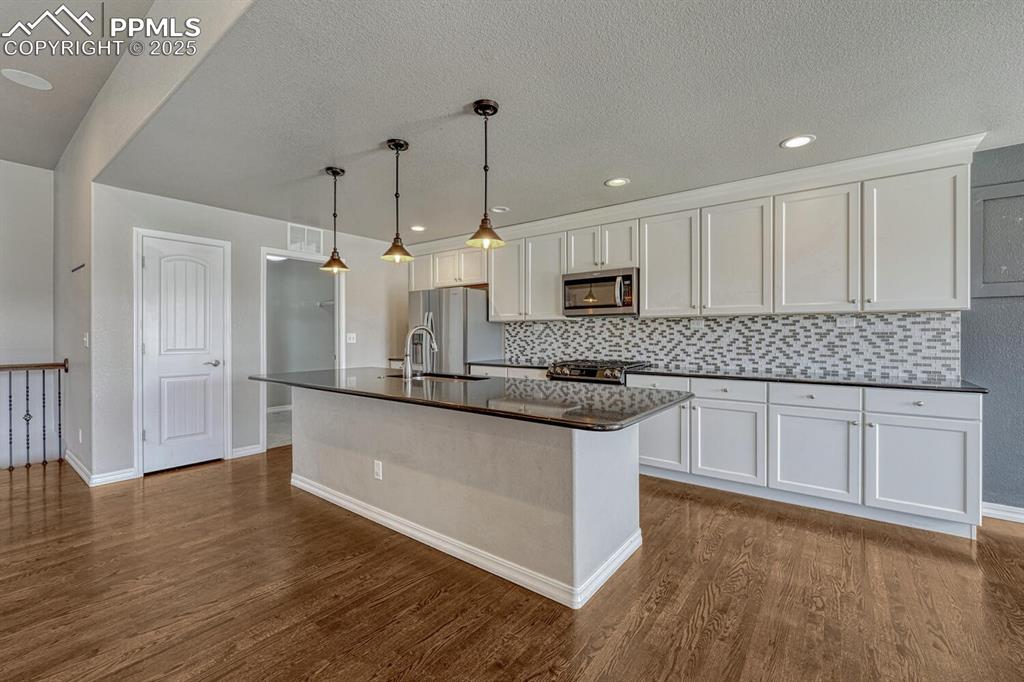 Image 16 of 45: Bring your passion for cooking to life in this exceptional kitchen, boastin