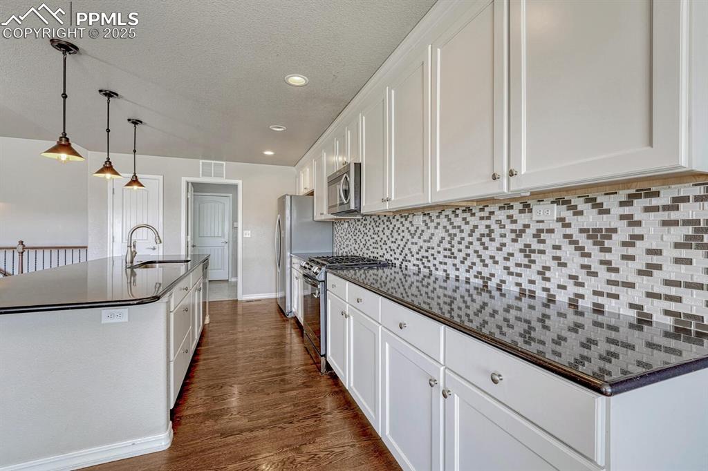 Image 17 of 45: Bring your passion for cooking to life in this exceptional kitchen, boastin