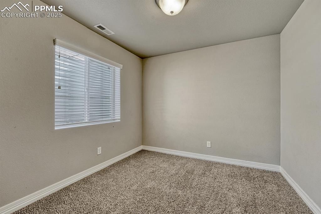Image 24 of 45: A carpeted spare room with baseboards offers endless possibilities for tran