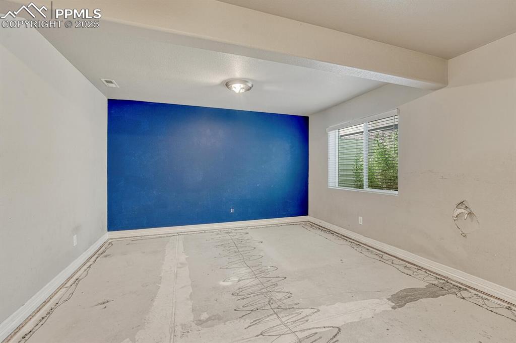 Image 28 of 45: This spare bedroom is ready for your personal touch, featuring baseboards, 