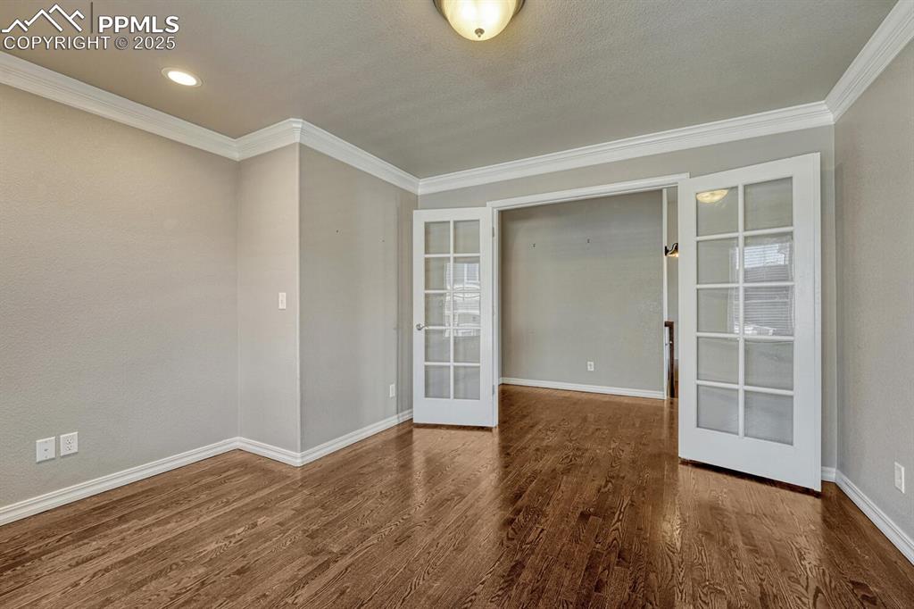 Image 5 of 45: Step into a haven of refinement and efficiency, where french doors, intrica