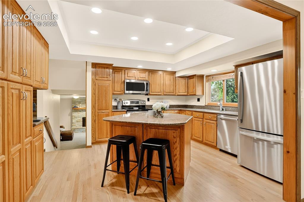 Image 6 of 21: Island & stone counters